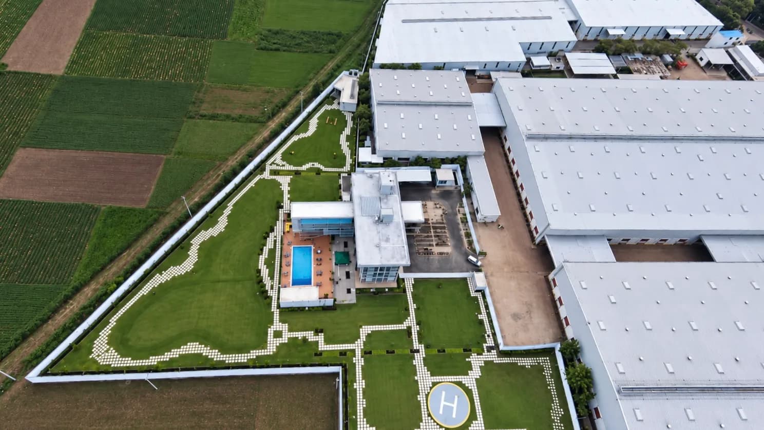 Aerial view of a factory complex with helipad built by Liton Steel